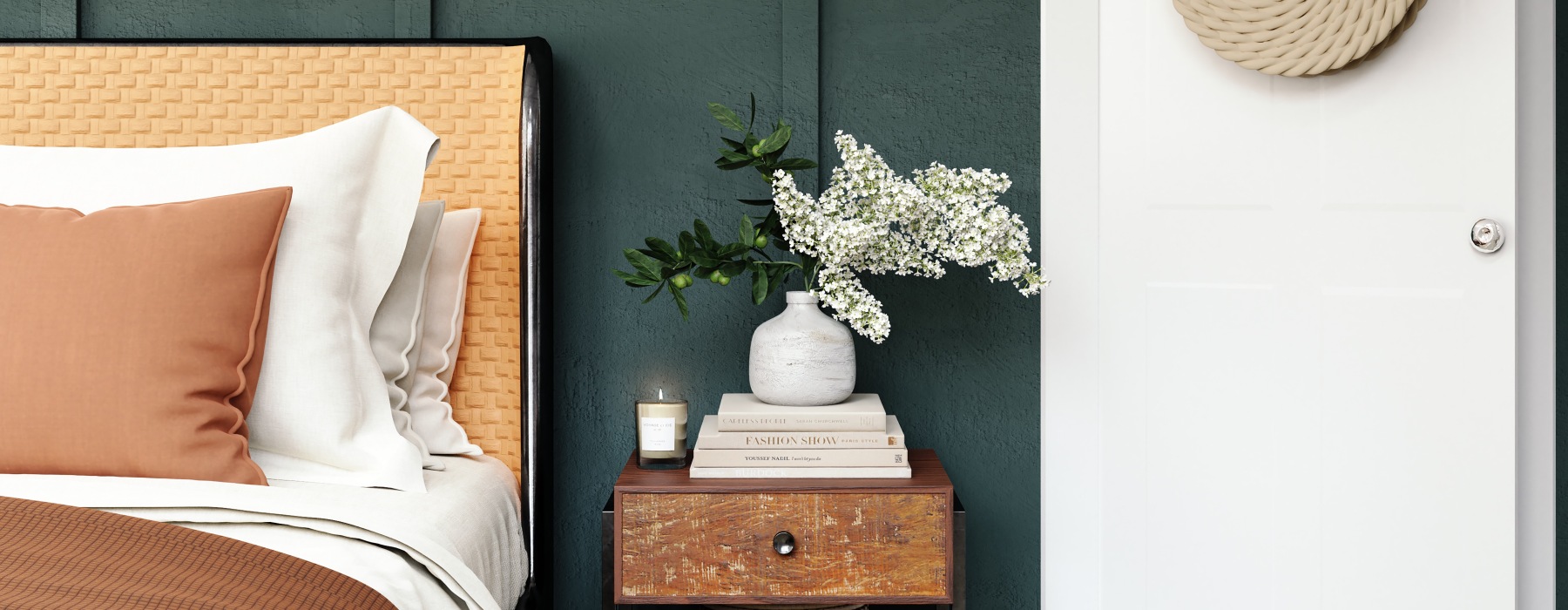 bed with a table with a plant on it
